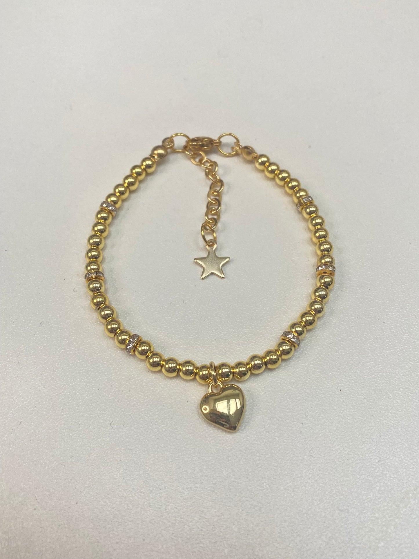 18k gold filled valentine heart beaded bracelet shown with an 18k gold plated heart pendant necklace with a stainless steel chain perfect gift for valentines day, date night, birthday, mothers day, or christmas. Handmade jewelry made to order.