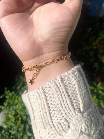 Pretty pink valentine flower crystal beaded bracelet with pink/orange pearls and 18k gold beads. Crystal flowers are a shiny pink. Perfect gift for all occasions; christmas, valentines, birthdays, mothers day