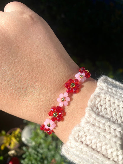 Pretty pink and red valentine flower crystal beaded bracelet with 18k gold beads. Crystal flowers are a pastel pink and a shiny red. Perfect gift for all occasions; christmas, valentines, birthdays, mothers day