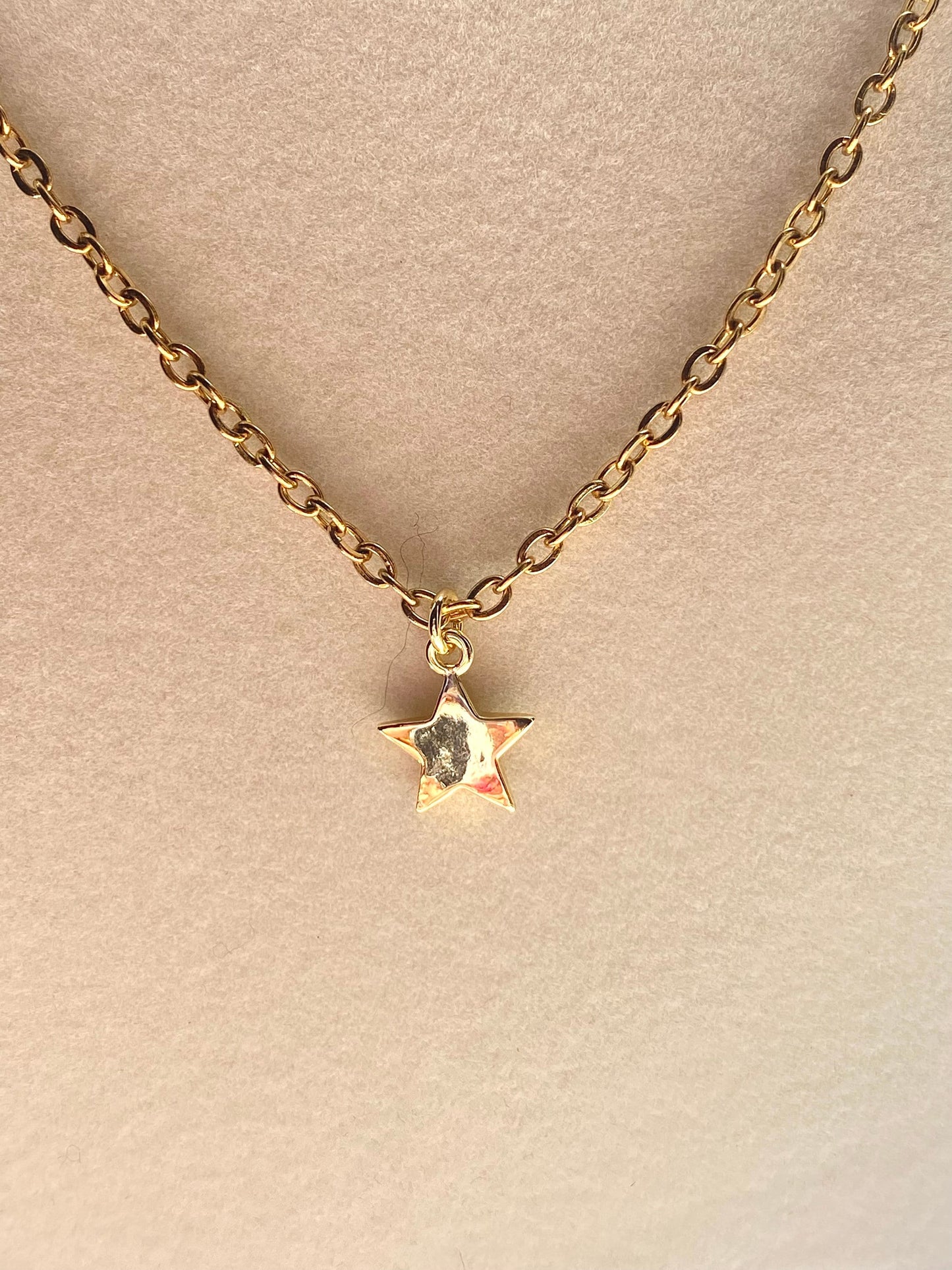 Showing an 18k Gold plated Star pendant necklace perfect gift for any friend or special person in your life. Perfect gift for a birthday or christmas or any holiday!