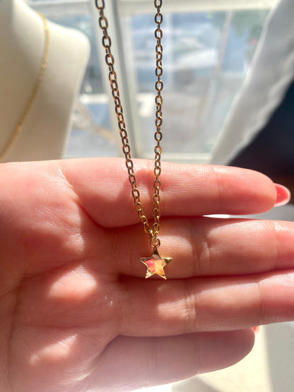 Showing an 18k Gold plated Star pendant necklace perfect gift for any friend or special person in your life. Perfect gift for a birthday or christmas or any holiday!