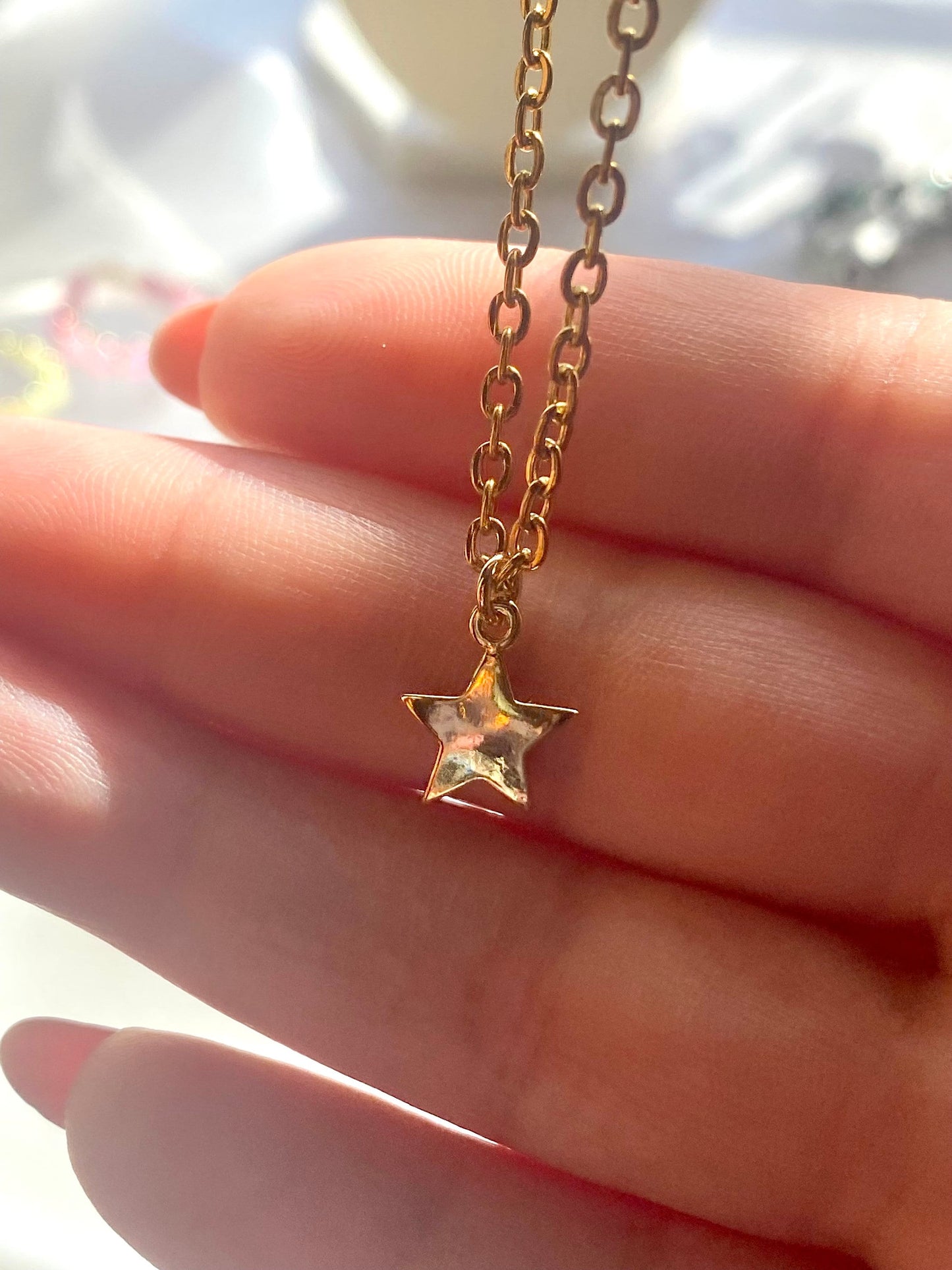 Showing an 18k Gold plated Star pendant necklace perfect gift for any friend or special person in your life. Perfect gift for a birthday or christmas or any holiday!