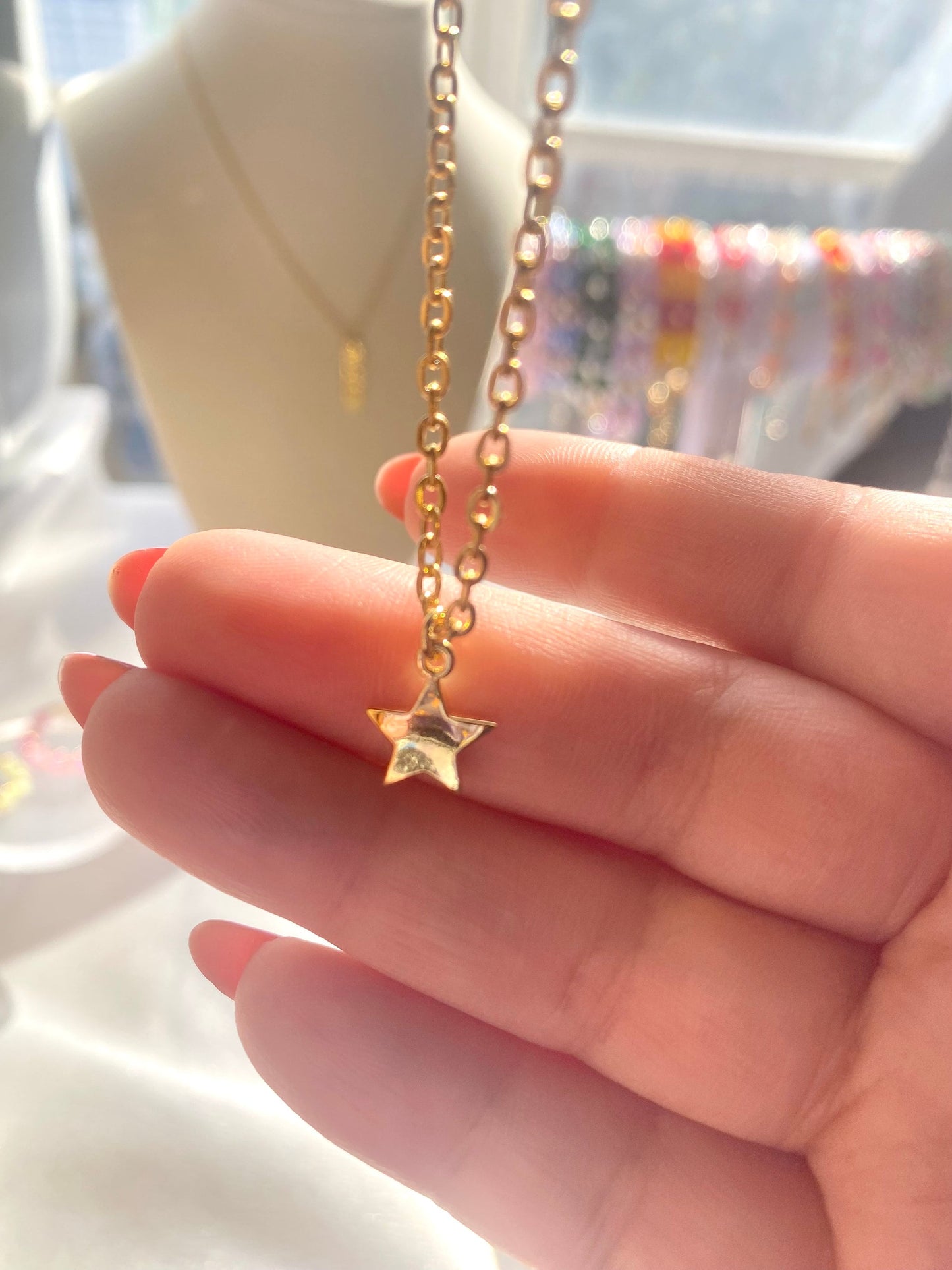 Showing an 18k Gold plated Star pendant necklace perfect gift for any friend or special person in your life. Perfect gift for a birthday or christmas or any holiday!